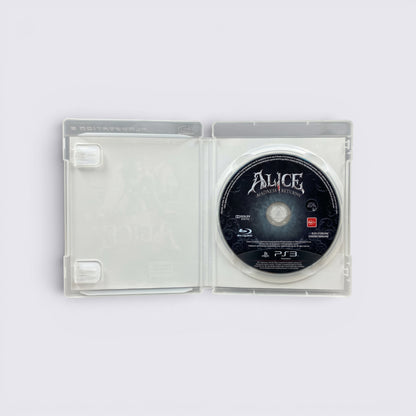 MrPixel Alice: Madness Returns PS3 game disc inside an open clear plastic case featuring gothic branding.