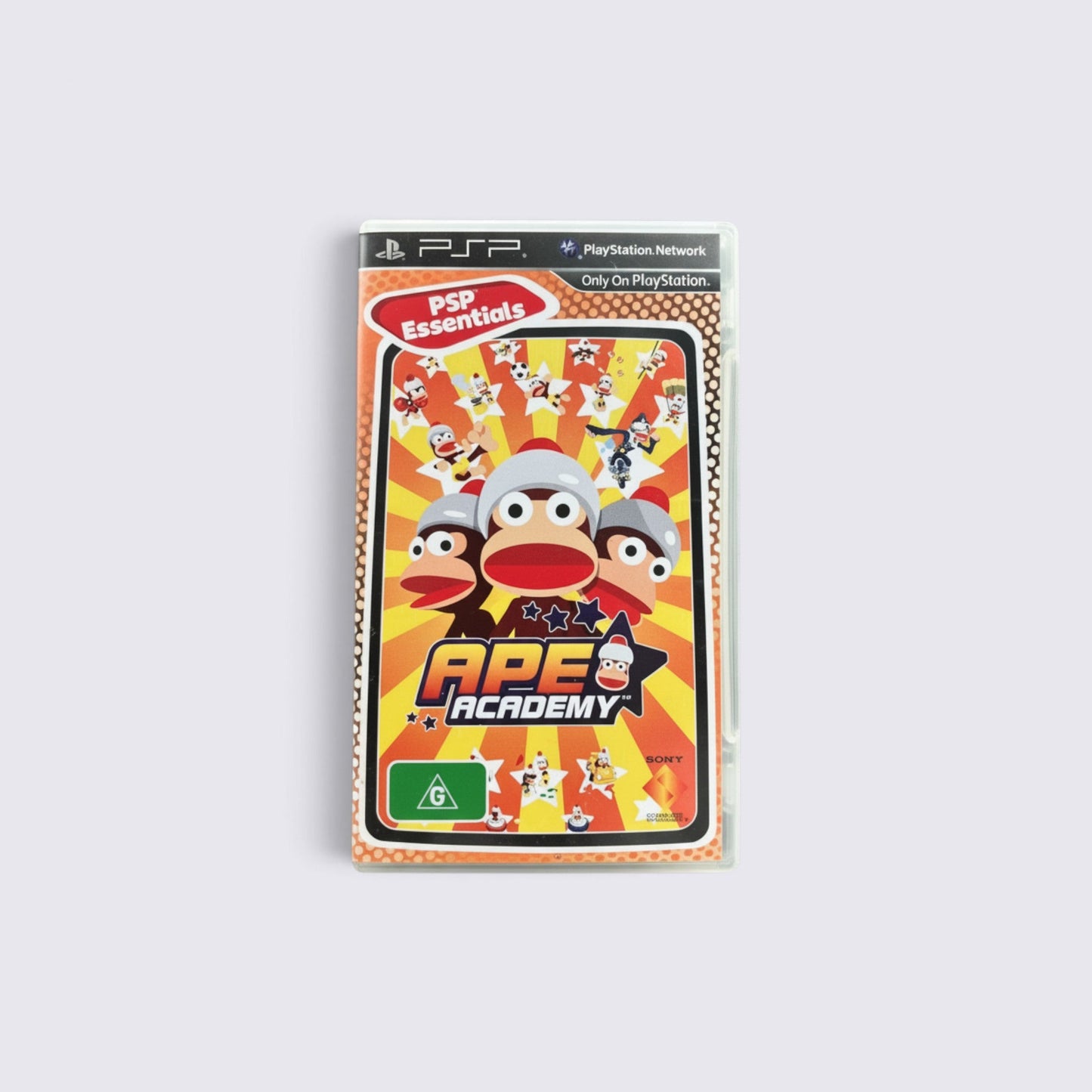 MrPixel Ape Academy Essentials PSP game case featuring colorful monkey characters and a G rating label