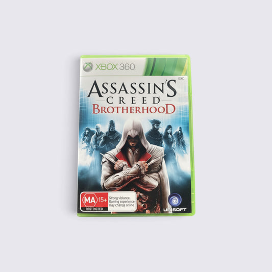 MrPixel Assassin's Creed: Brotherhood Xbox 360 game case featuring Ezio Auditore and other assassins in Rome.