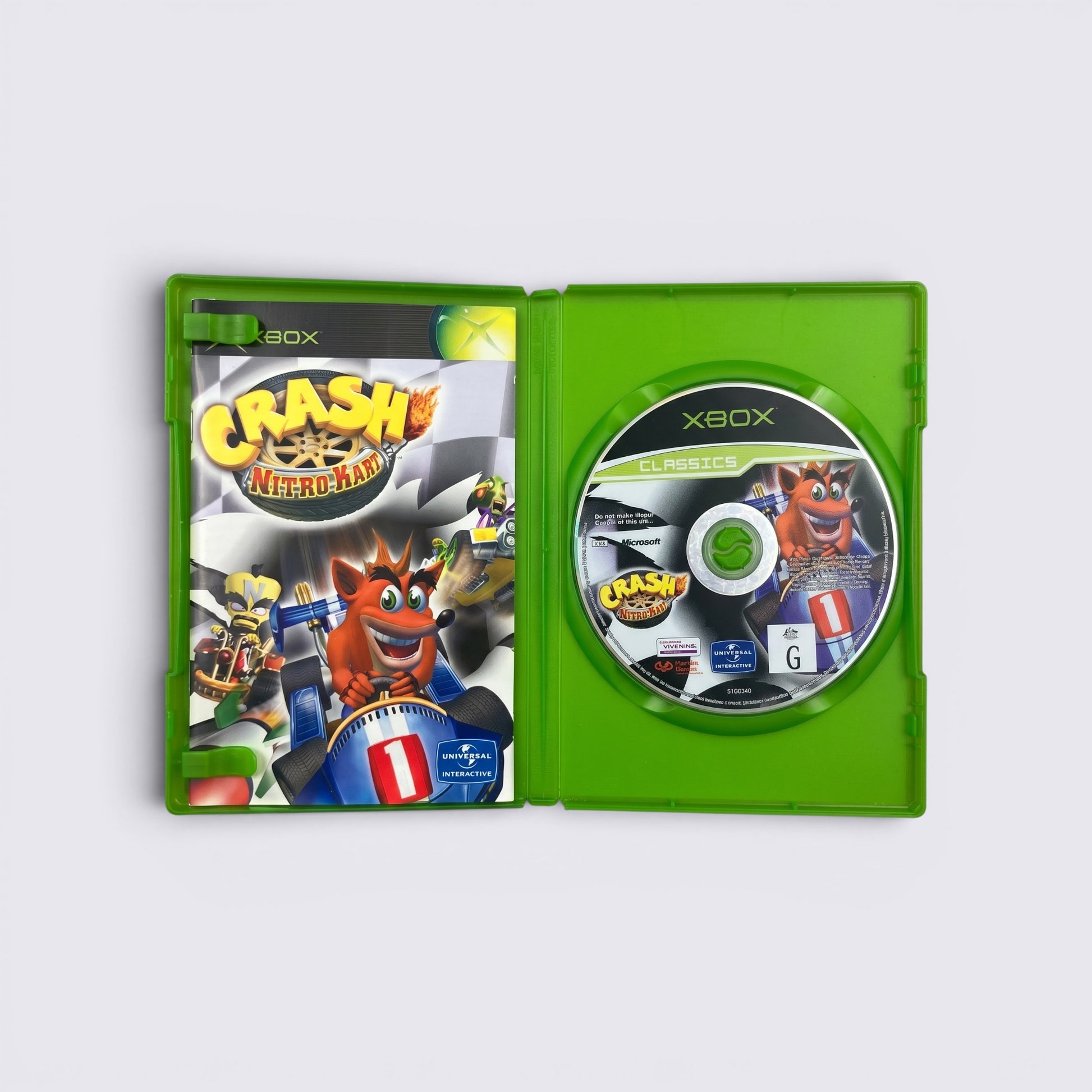 MrPixel Crash Nitro Kart Classics Xbox game disc and manual inside a green plastic case
