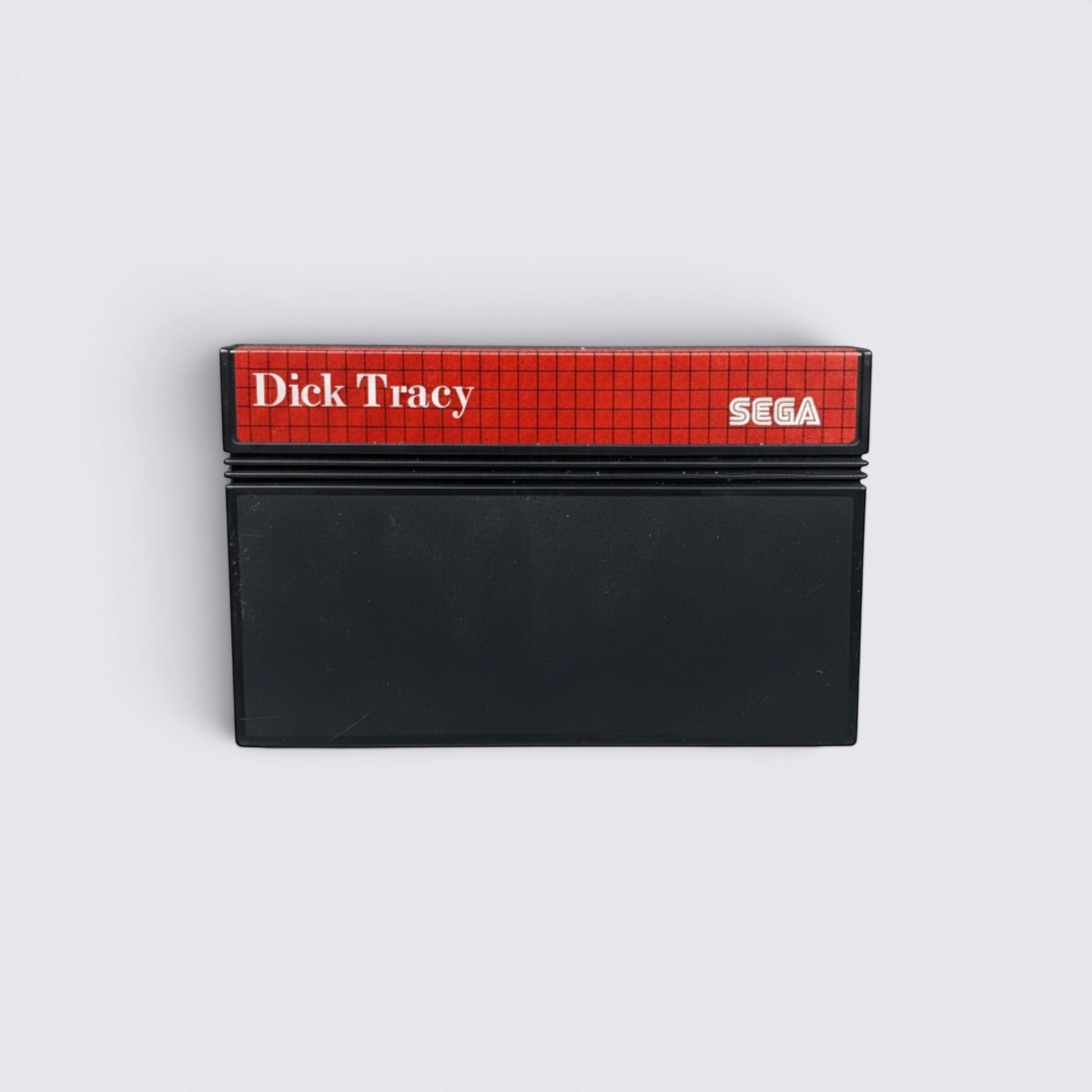 MrPixel Dick Tracy SEGA video game cartridge with a red grid label and black plastic casing.
