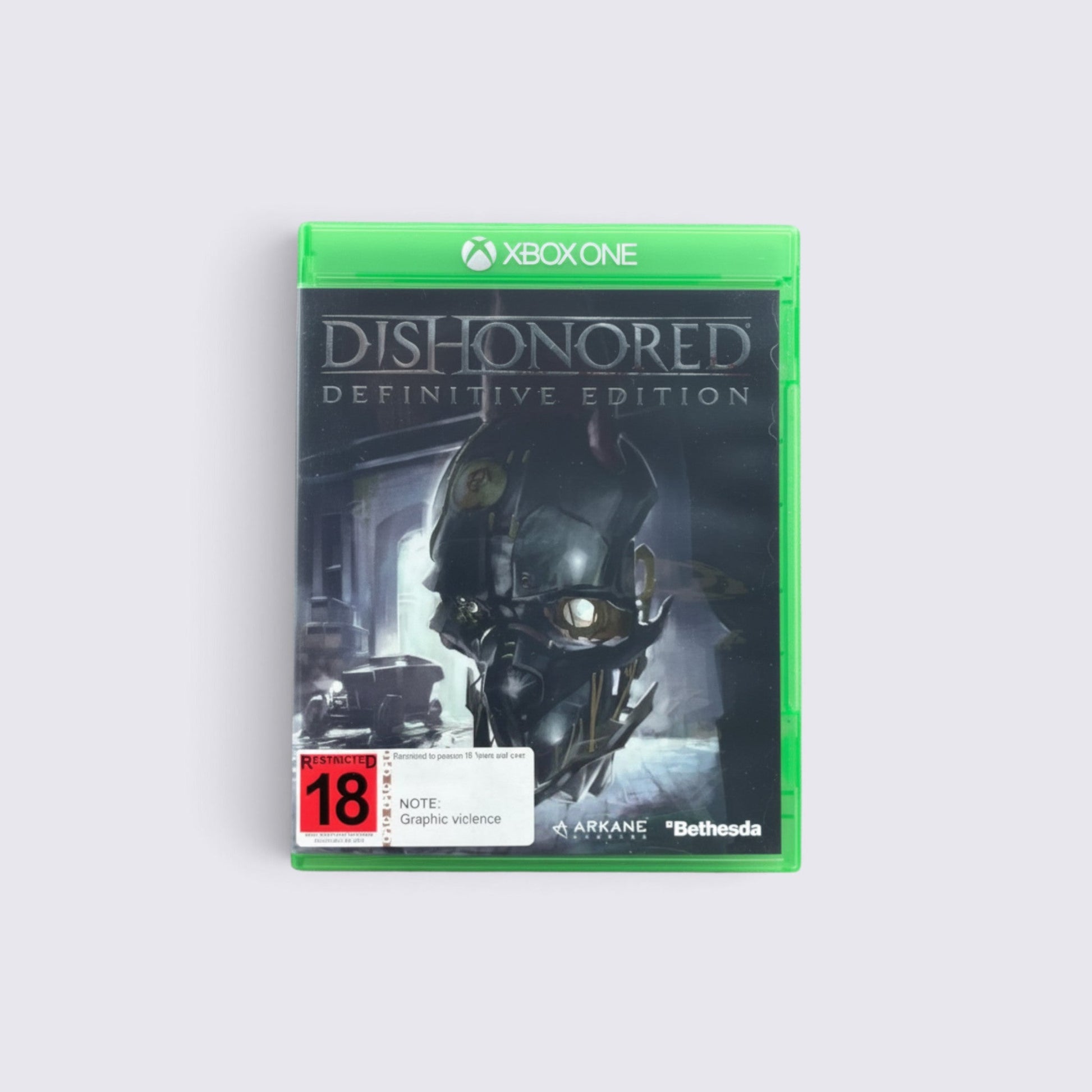 MrPixel Dishonored: Definitive Edition Xbox One game case featuring the iconic mask artwork on a green plastic box.
