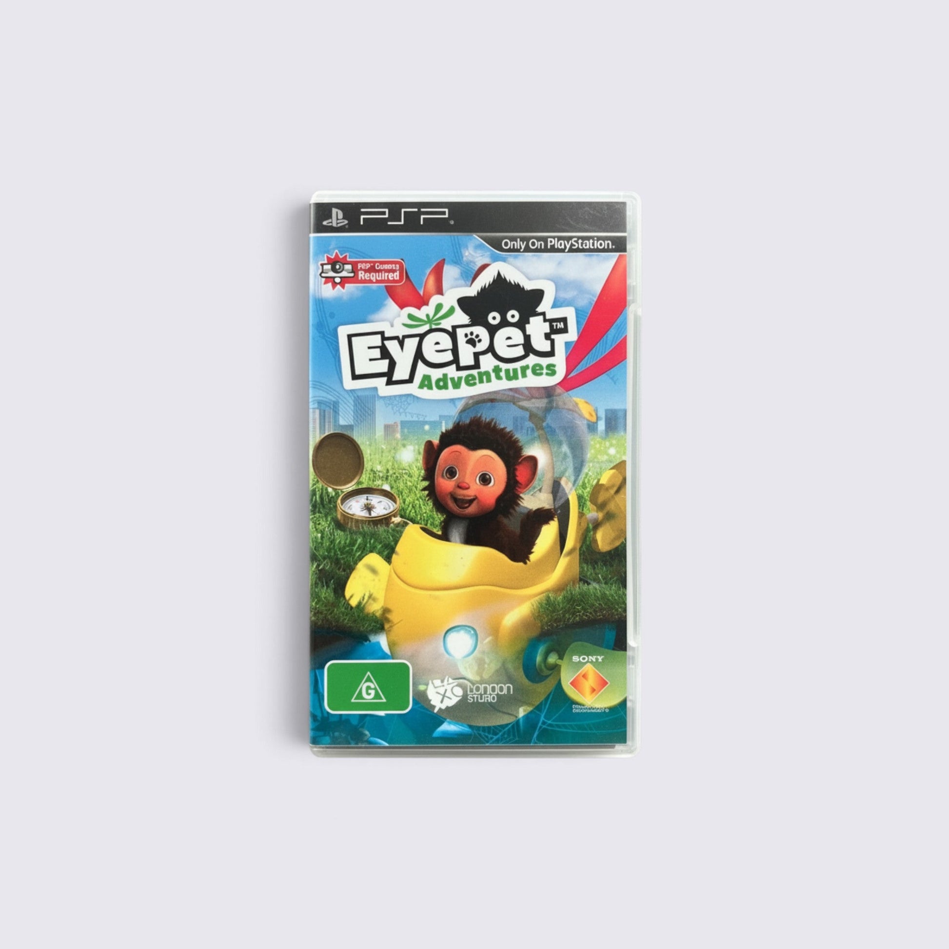 MrPixel EyePet Adventures PSP game case featuring a cute virtual pet in a yellow vehicle on a green field