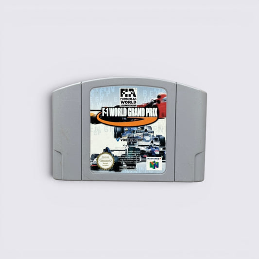 MrPixel F-1 World Grand Prix Nintendo 64 game cartridge with racing car cover art on a grey stone background.