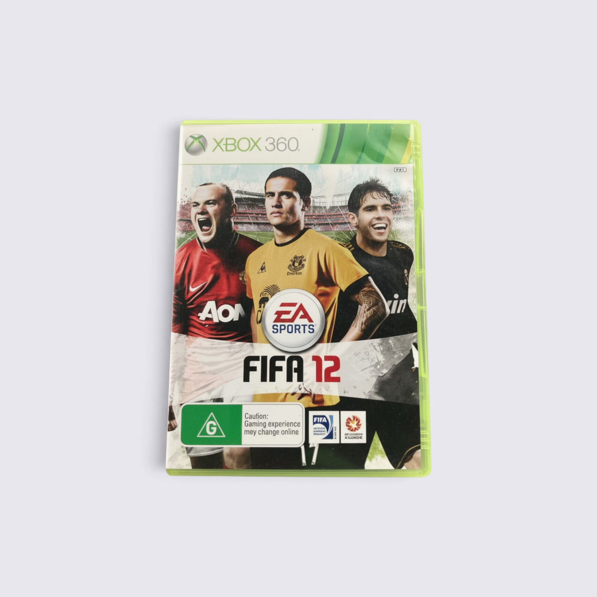 MrPixel FIFA 12 Xbox 360 game case featuring Wayne Rooney, Tim Cahill, and Kaka on the cover art.