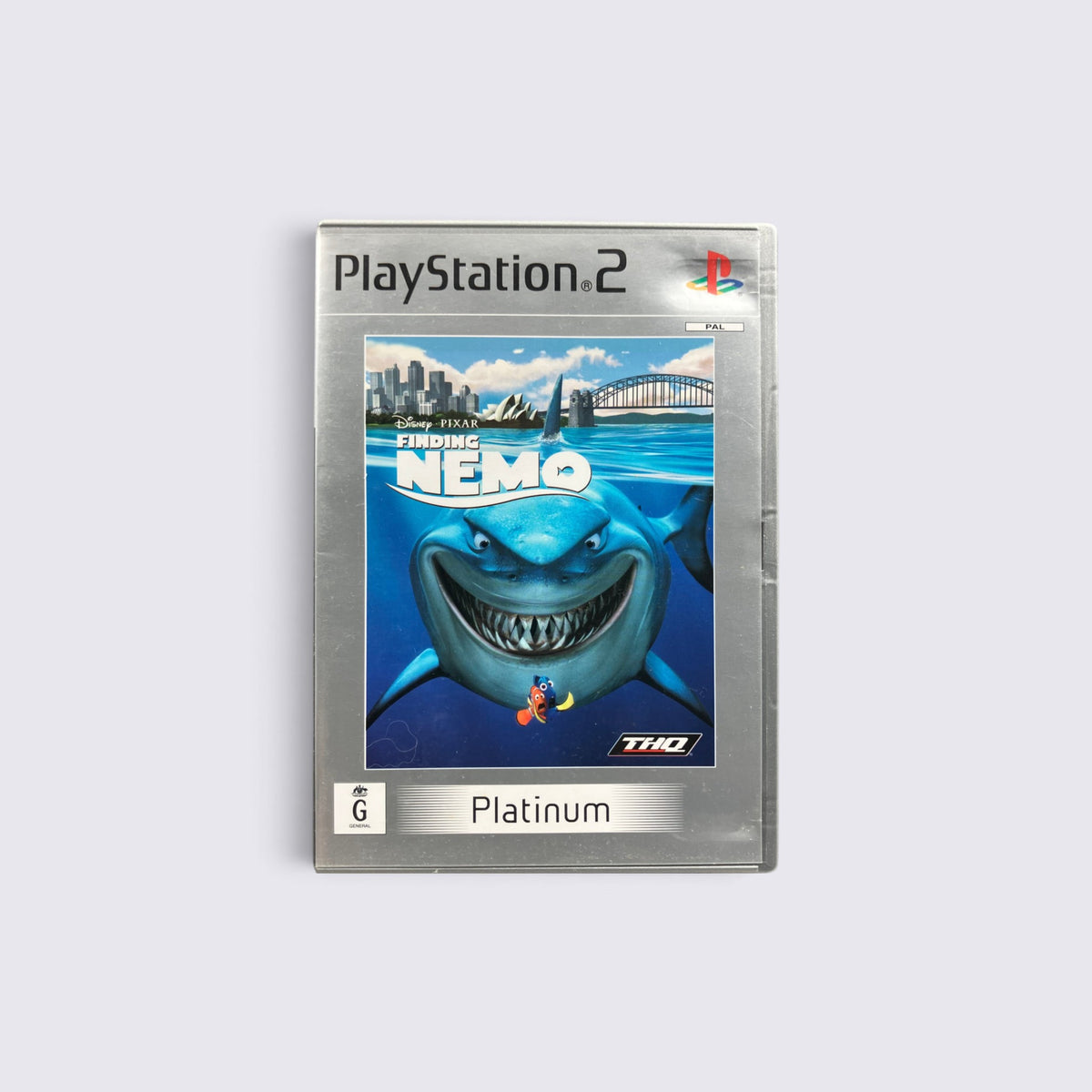 MrPixel Finding Nemo Platinum edition game for PlayStation 2 featuring Bruce the shark on the cover art