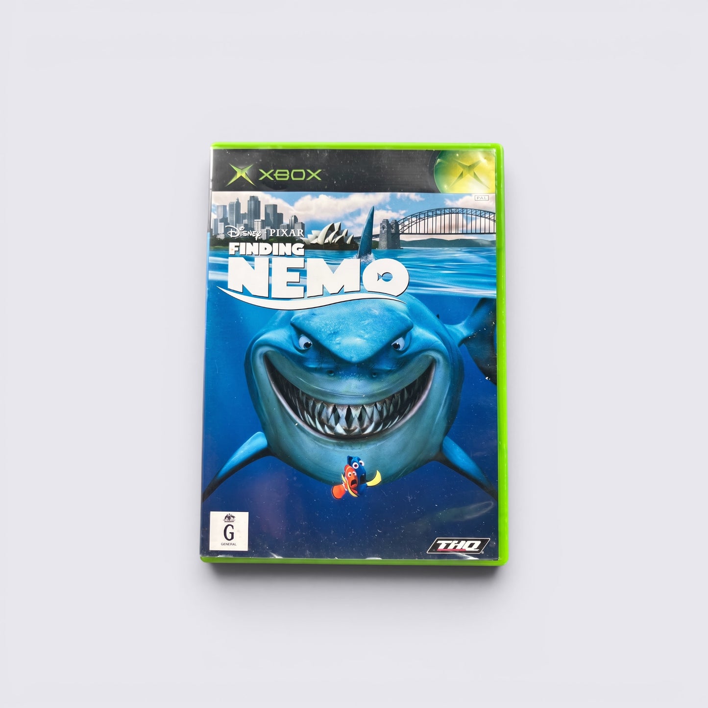 MrPixel Finding Nemo Xbox video game case featuring Bruce the shark and Nemo against a Sydney harbour backdrop.