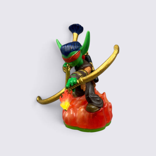 MrPixel Flameslinger Skylander figure with green skin, blue hair, and gold bow standing on a translucent fire base.