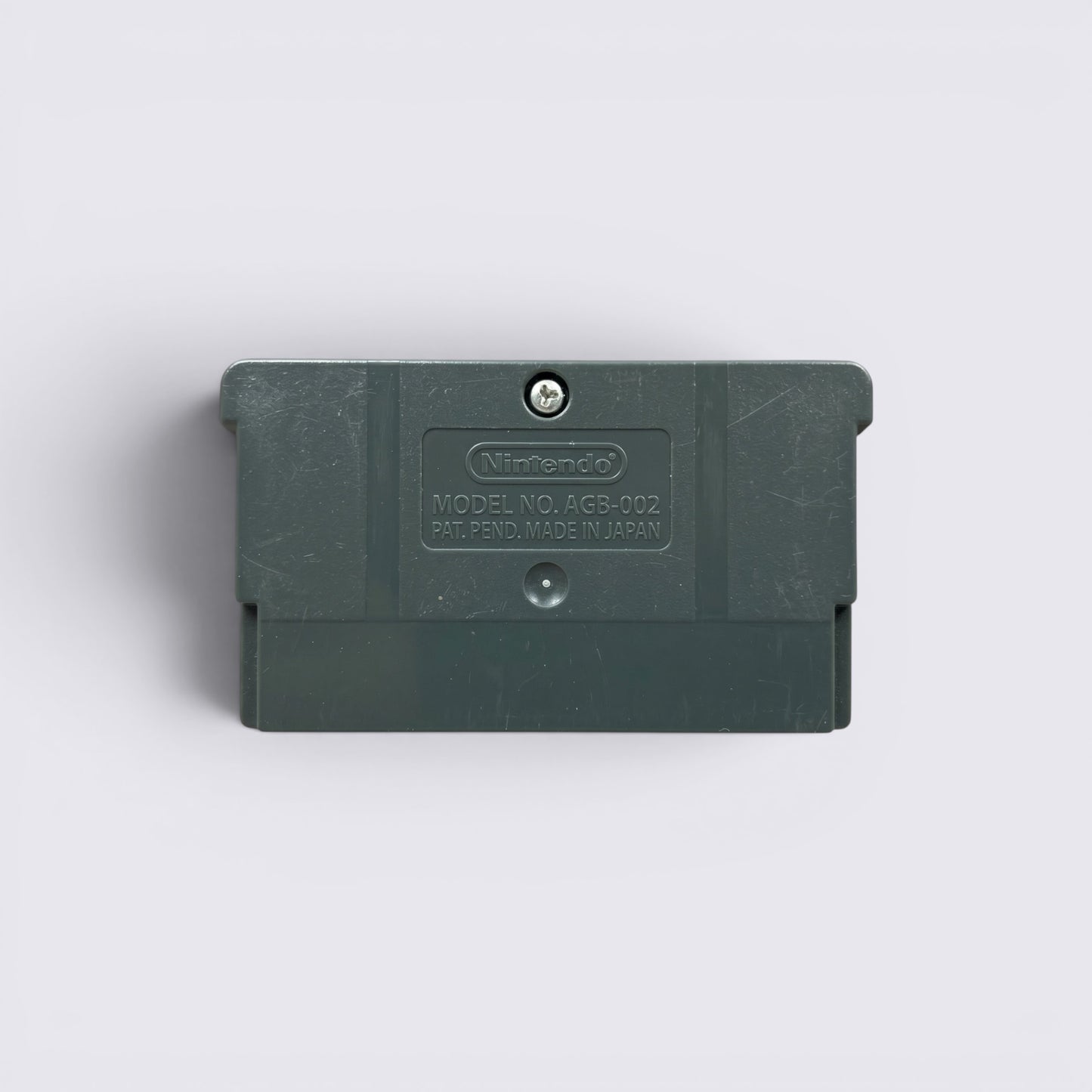 Back view of a grey MrPixel Game Boy Advance game cartridge showing the Nintendo logo and model number AGB-002.
