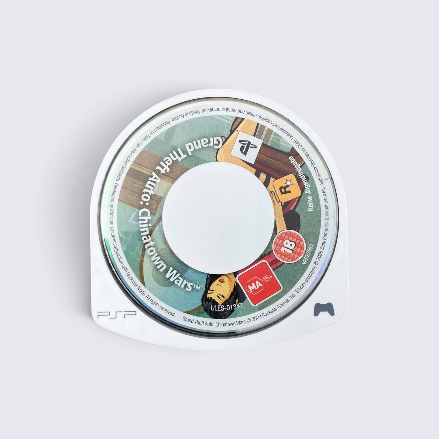 MrPixel Grand Theft Auto: Chinatown Wars PSP game disc with stylized comic book art and MA 15+ rating label.