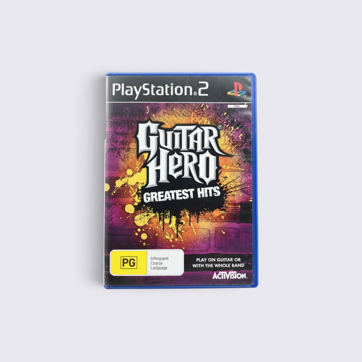 MrPixel Guitar Hero: Greatest Hits PlayStation 2 game case featuring vibrant yellow and purple paint splatter art.