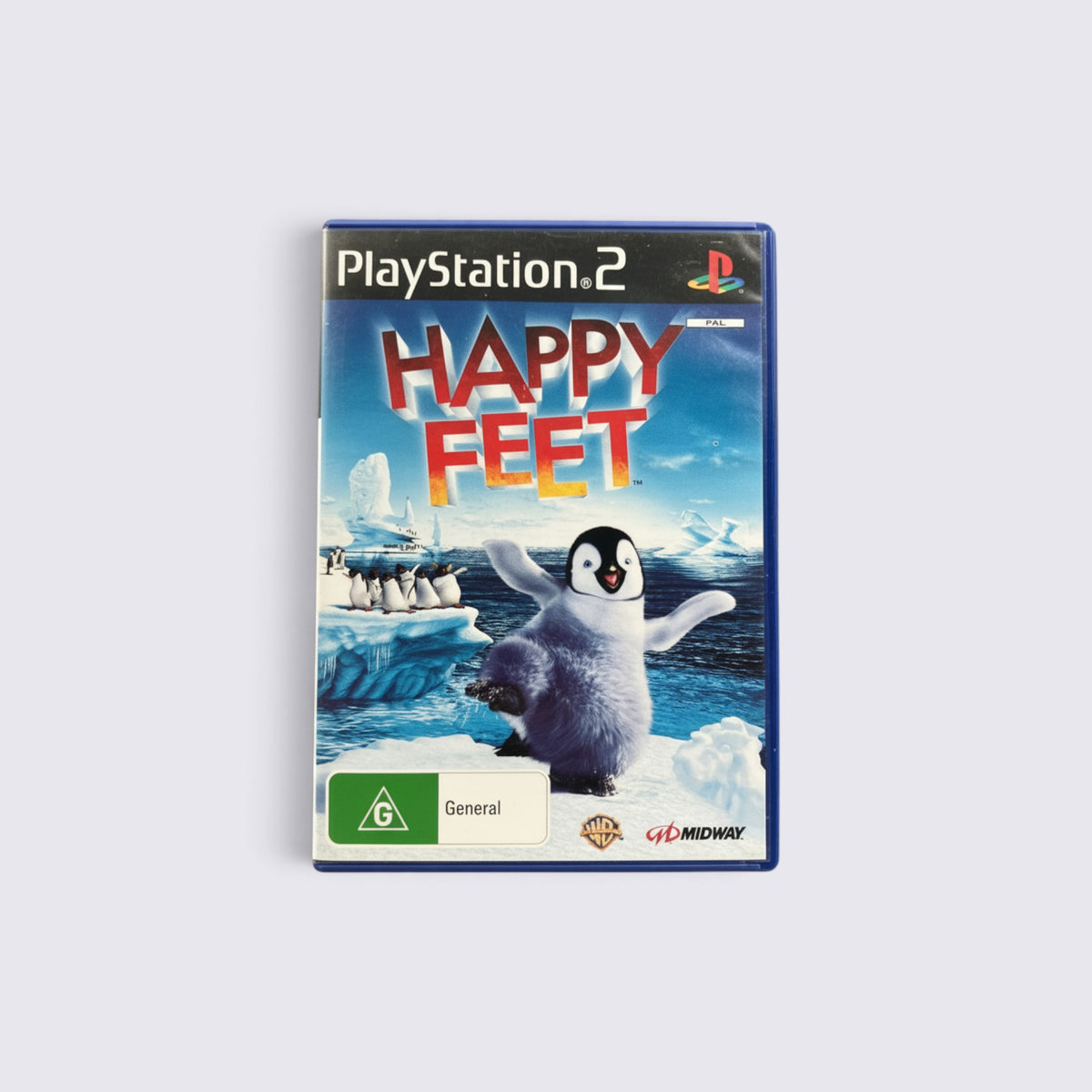 MrPixel Happy Feet PlayStation 2 game case featuring Mumble the penguin dancing on ice in an Antarctic setting