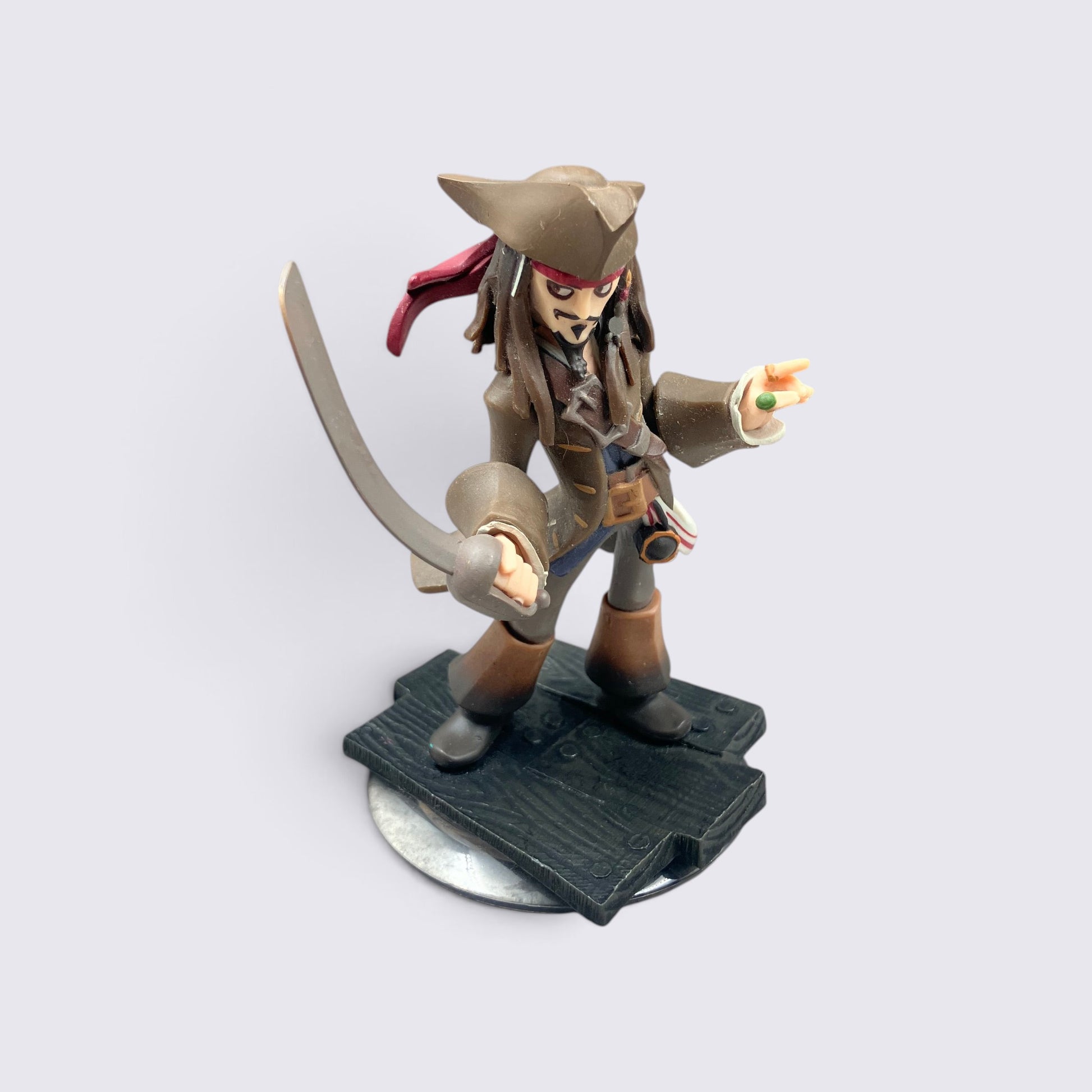 MrPixel Jack Sparrow Disney Infinity figure holding a sword, wearing a pirate hat and brown coat on a base.