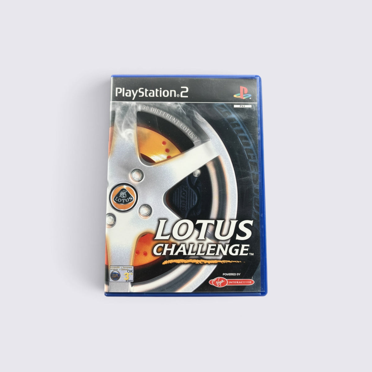 MrPixel Lotus Challenge racing game for PlayStation 2 featuring a silver alloy wheel design on the cover art.