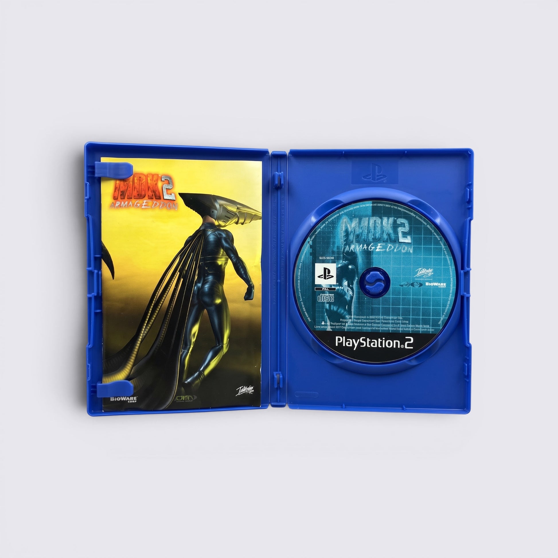 MrPixel MDK 2 Armageddon PlayStation 2 game case open with disc and cover art featuring a sci-fi character