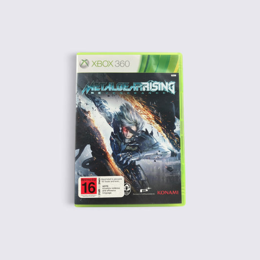 MrPixel Metal Gear Rising: Revengeance Xbox 360 game case featuring cyborg ninja Raiden in a dynamic action pose.