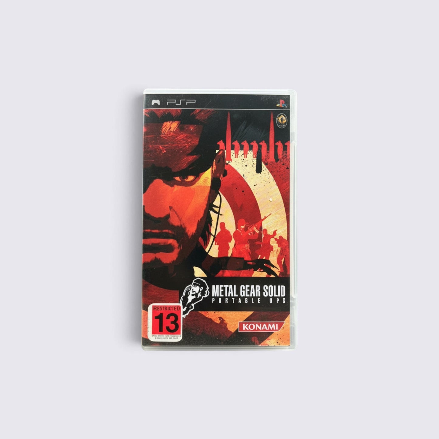 MrPixel Metal Gear Solid: Portable Ops PSP game case featuring Naked Snake artwork in red and black tones.
