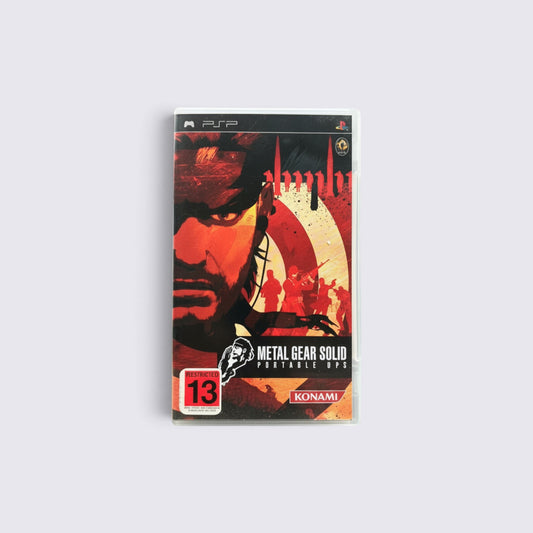 MrPixel Metal Gear Solid: Portable Ops PSP game case featuring Naked Snake artwork in red and black tones.