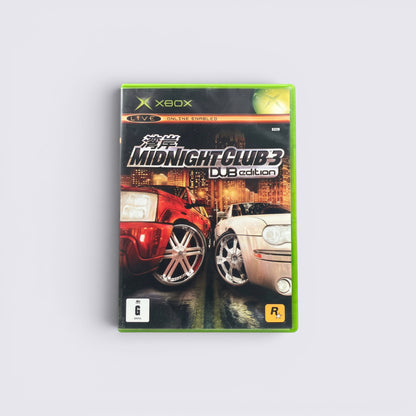MrPixel Midnight Club 3 DUB Edition Xbox game case featuring red and silver custom cars against a city skyline