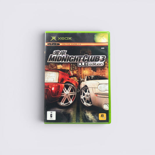 MrPixel Midnight Club 3 DUB Edition Xbox game case featuring red and silver custom cars against a city skyline