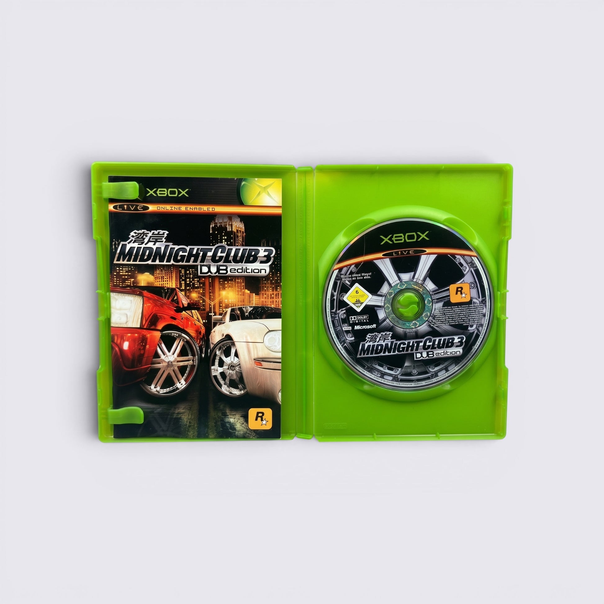 MrPixel Midnight Club 3: DUB Edition Xbox game case open with disc, featuring street racing cover art.