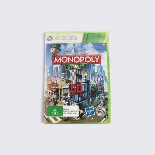 MrPixel Monopoly Streets Xbox 360 game case featuring a vibrant 3D city board game design and iconic Monopoly mascot.