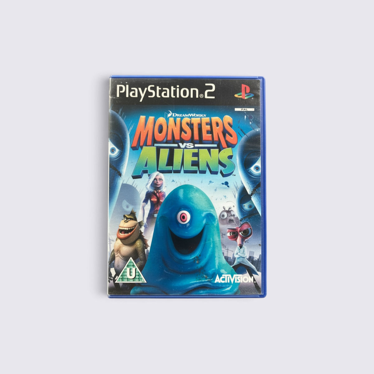 MrPixel Monsters vs Aliens PlayStation 2 game case featuring colourful movie characters on the front cover