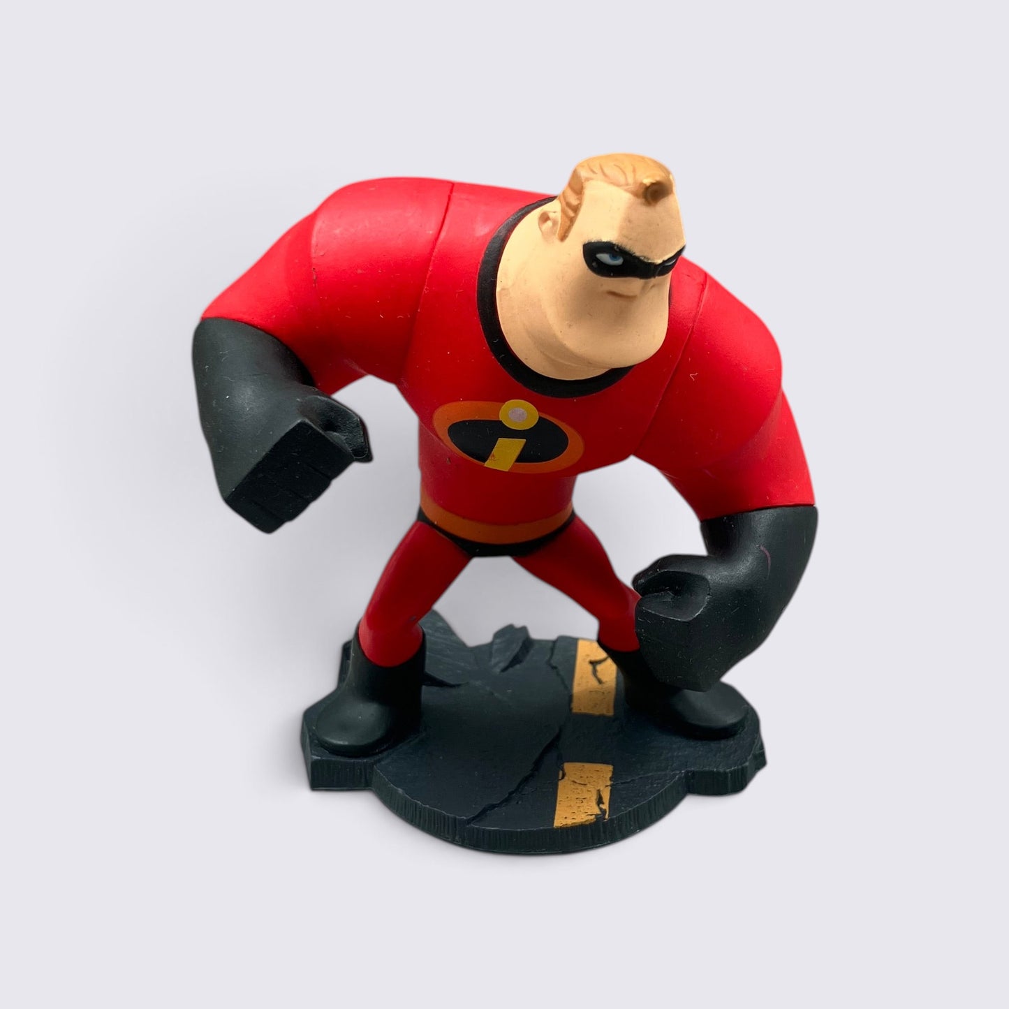 MrPixel Mr Incredible Disney Infinity figure in red superhero suit with black gloves standing on a cracked base