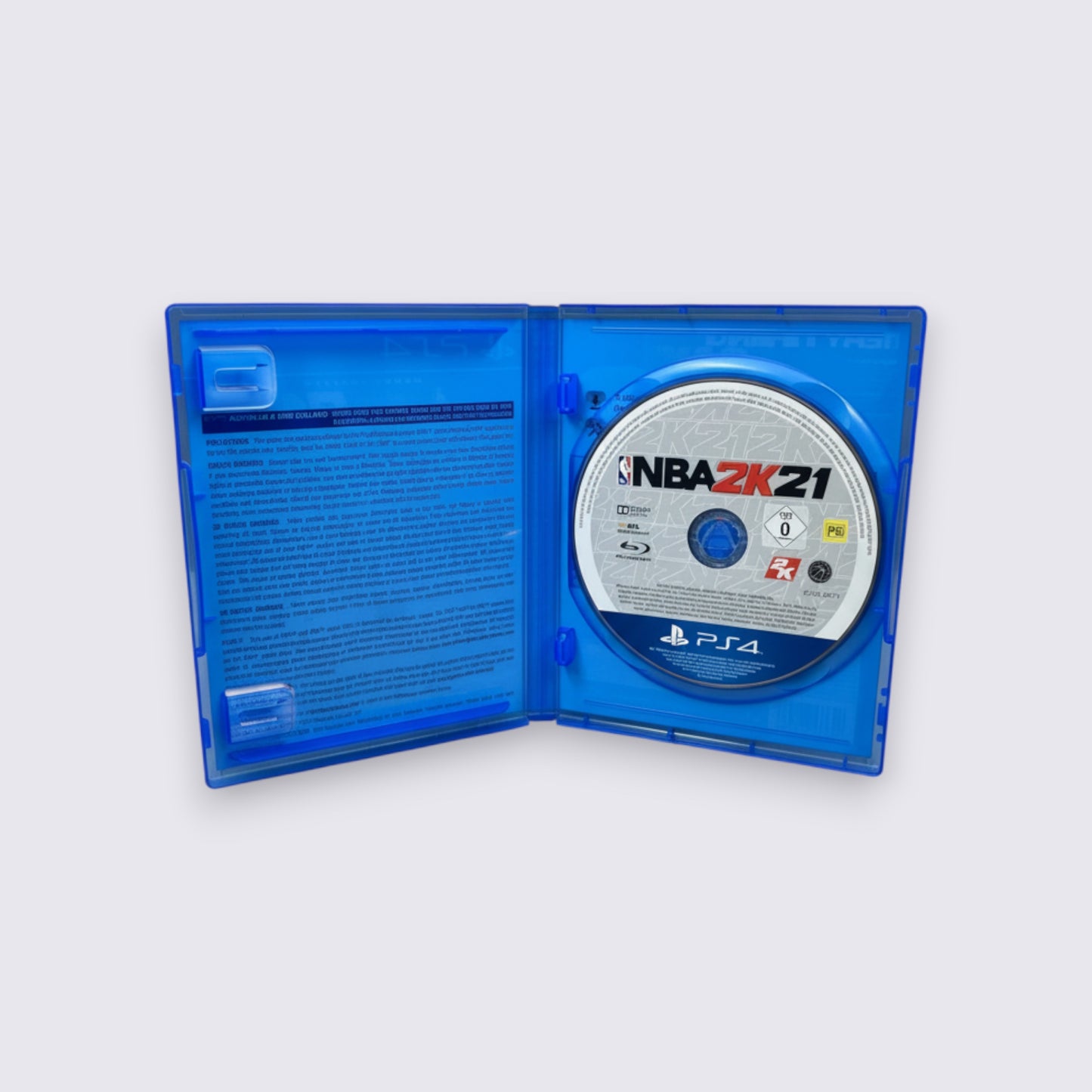MrPixel NBA 2K21 Mamba Forever Edition PS4 game disc inside an open blue plastic case on a grey background.