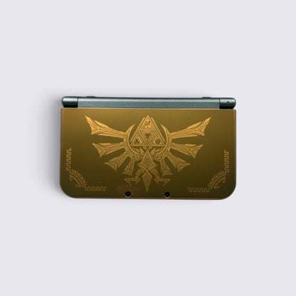 MrPixel New Nintendo 3DS XL Hyrule Edition console in gold with Hylian Crest and Triforce symbols on the cover