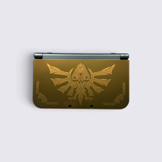 MrPixel New Nintendo 3DS XL Hyrule Edition console in gold with Hylian Crest and Triforce symbols on the cover