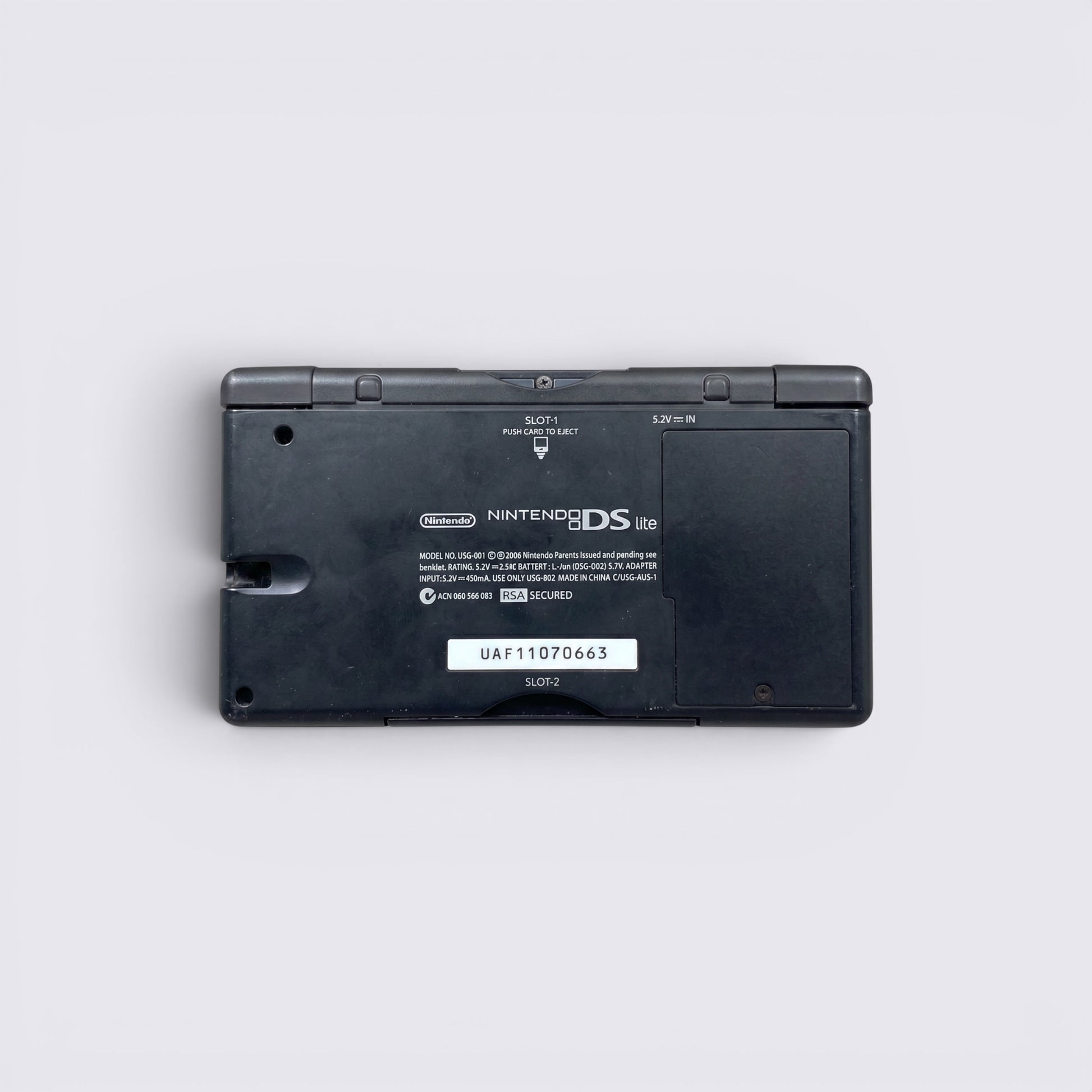 MrPixel Nintendo DS Lite Guitar Hero Edition handheld console back view showing model details and serial number