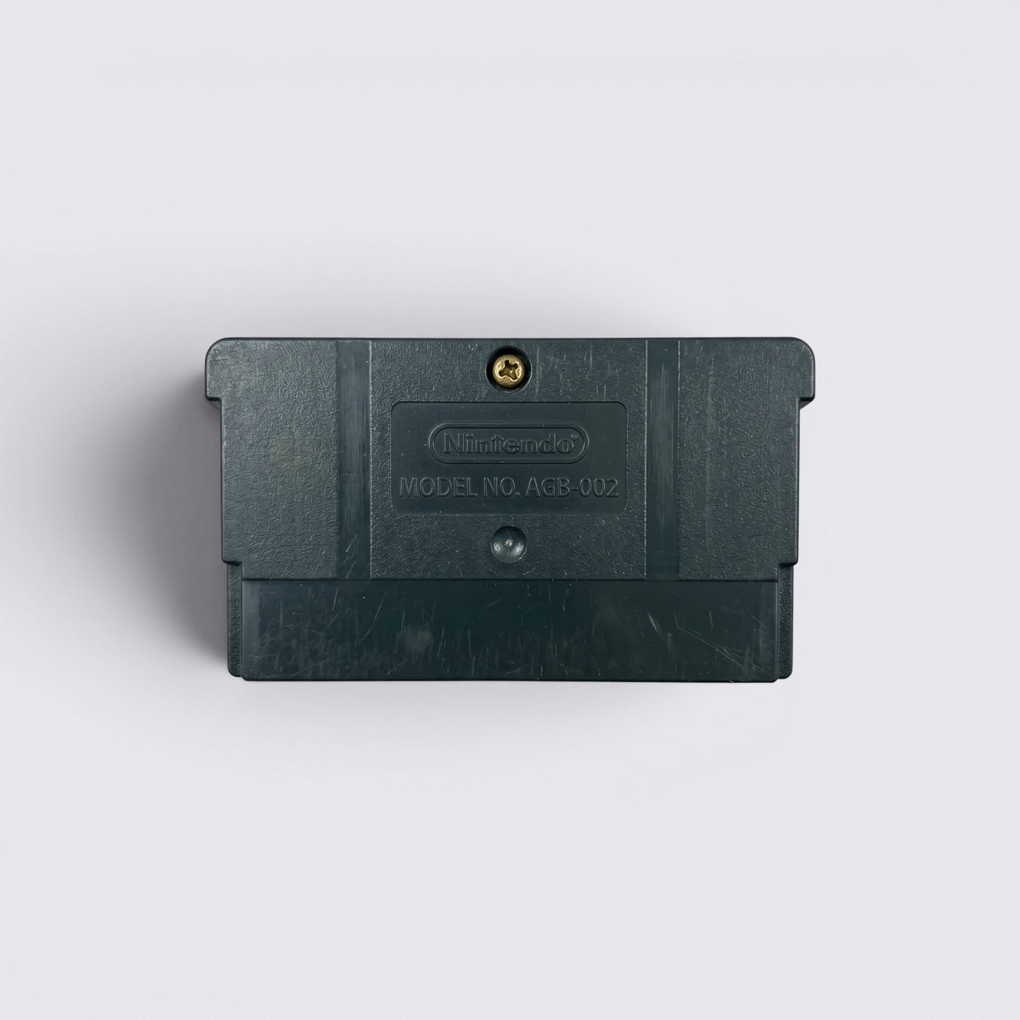 Back view of MrPixel Pirates of the Caribbean Game Boy Advance cartridge showing the black plastic casing and screw.