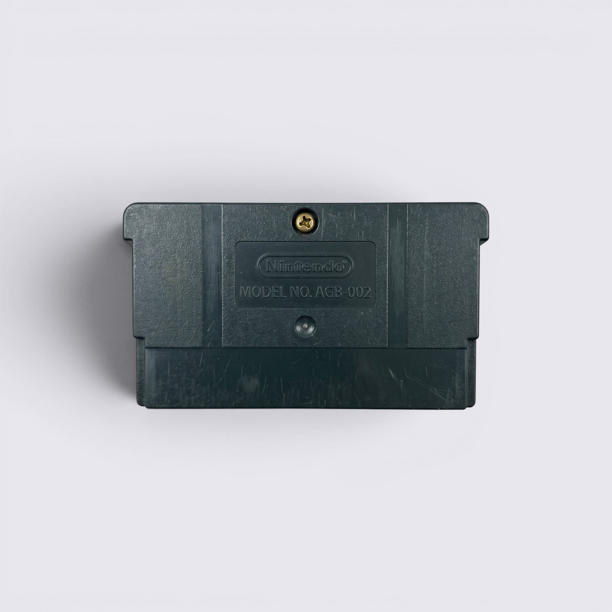 Back view of MrPixel Pirates of the Caribbean Game Boy Advance cartridge showing the black plastic casing and screw.