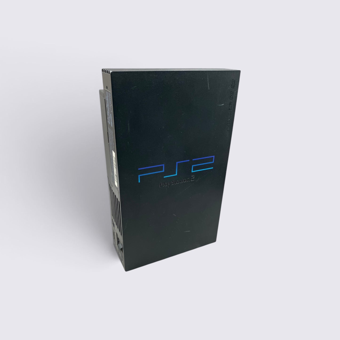 MrPixel black PlayStation 2 fat console standing vertically, featuring the iconic blue PS2 logo on the front panel.