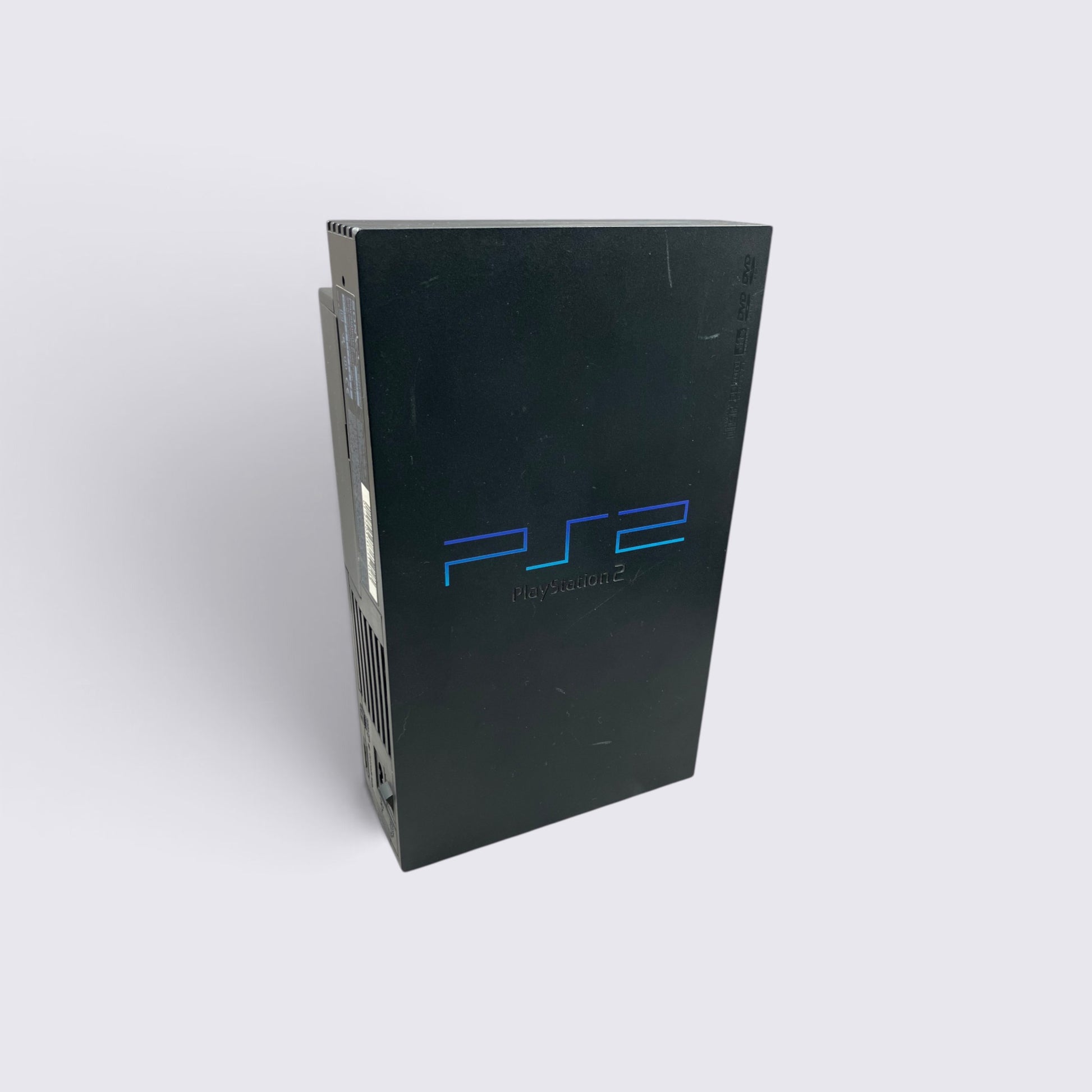 MrPixel black PlayStation 2 fat console standing vertically, featuring the iconic blue PS2 logo on the front panel.