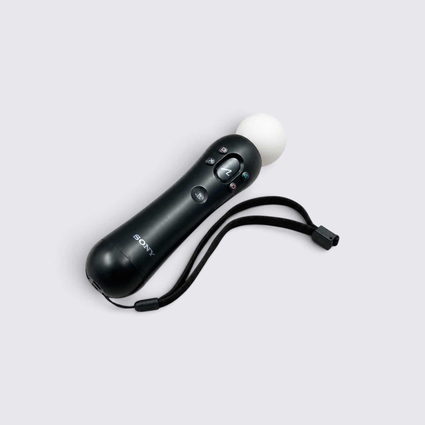 MrPixel PlayStation 3 Move motion controller in black with a white tracking sphere and attached wrist strap