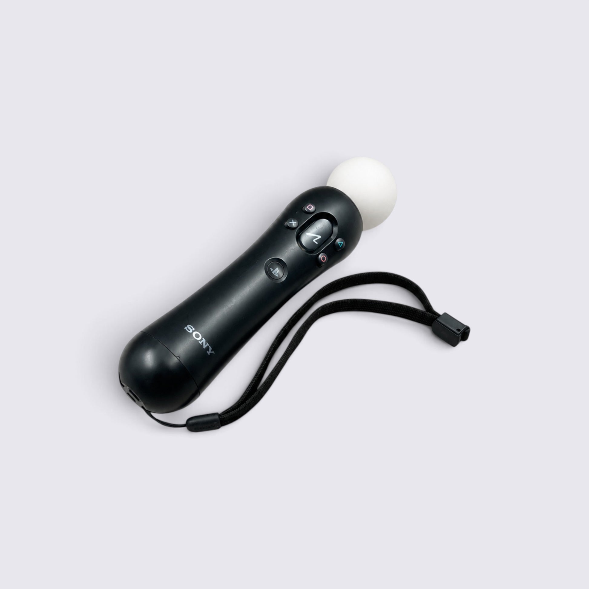 MrPixel PlayStation 3 Move motion controller in black with a white tracking sphere and attached wrist strap