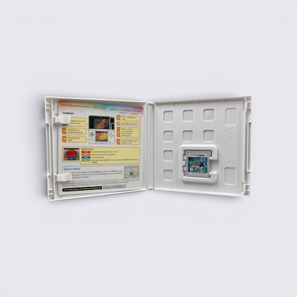 MrPixel Pokemon X Nintendo 3DS game cartridge inside an open white plastic case with an instructional manual insert.