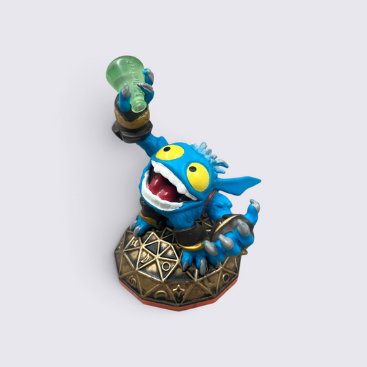 MrPixel Pop Fizz Skylander figure holding a green potion bottle, featuring blue skin and large yellow eyes.