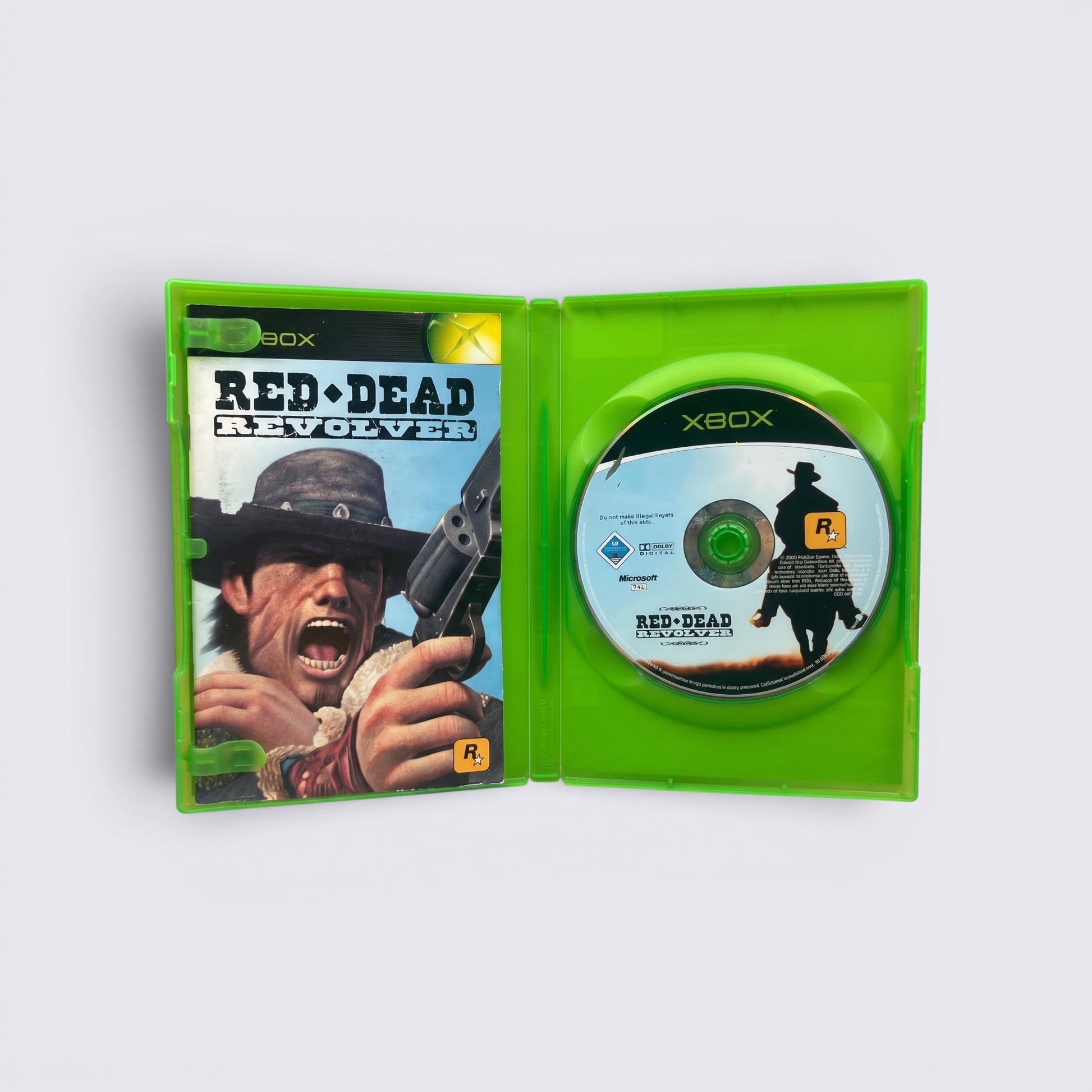 MrPixel Red Dead Revolver Xbox game case opened to show cover art and game disc featuring Red Harlow
