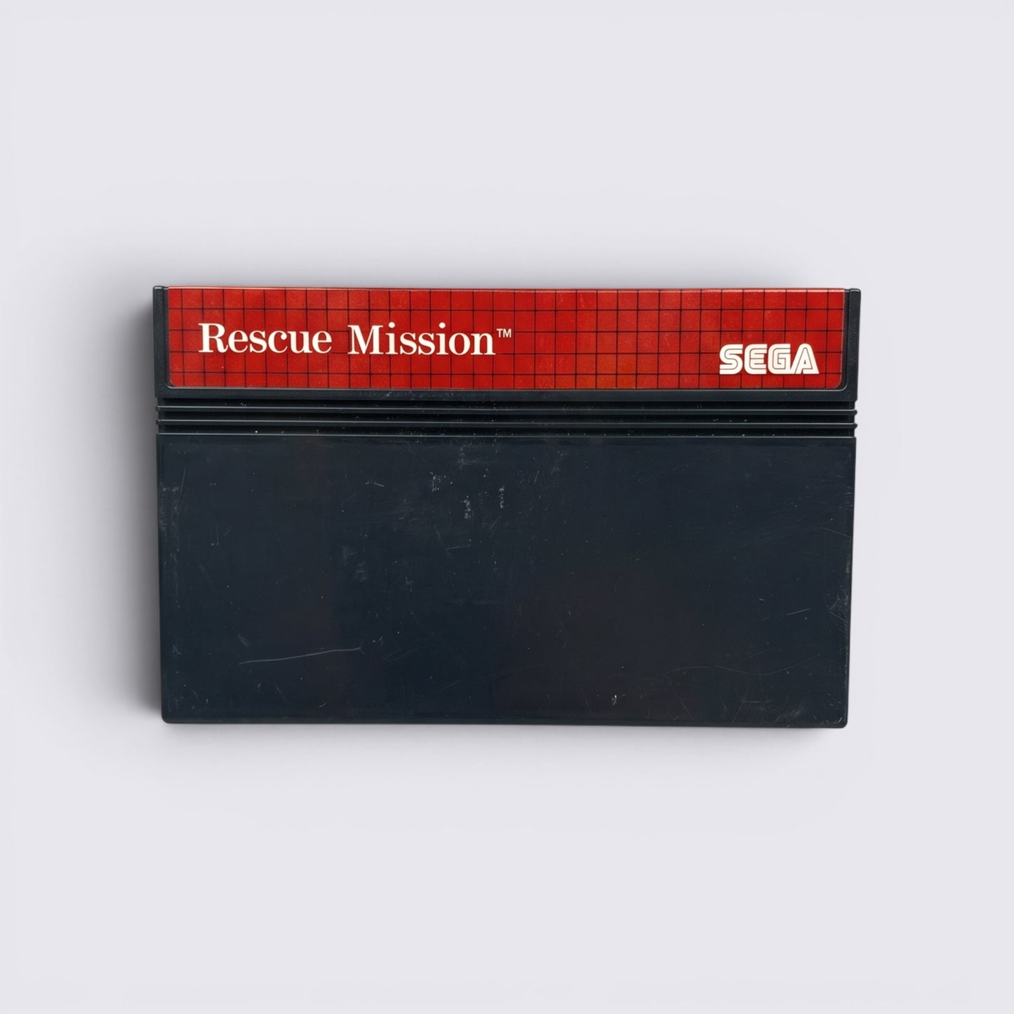 MrPixel Rescue Mission Sega Master System game cartridge with red grid label and black plastic casing.