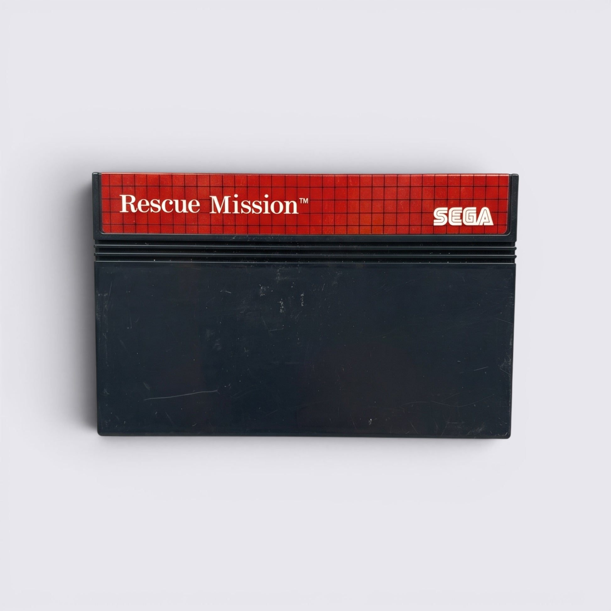 MrPixel Rescue Mission Sega Master System game cartridge with red grid label and black plastic casing.