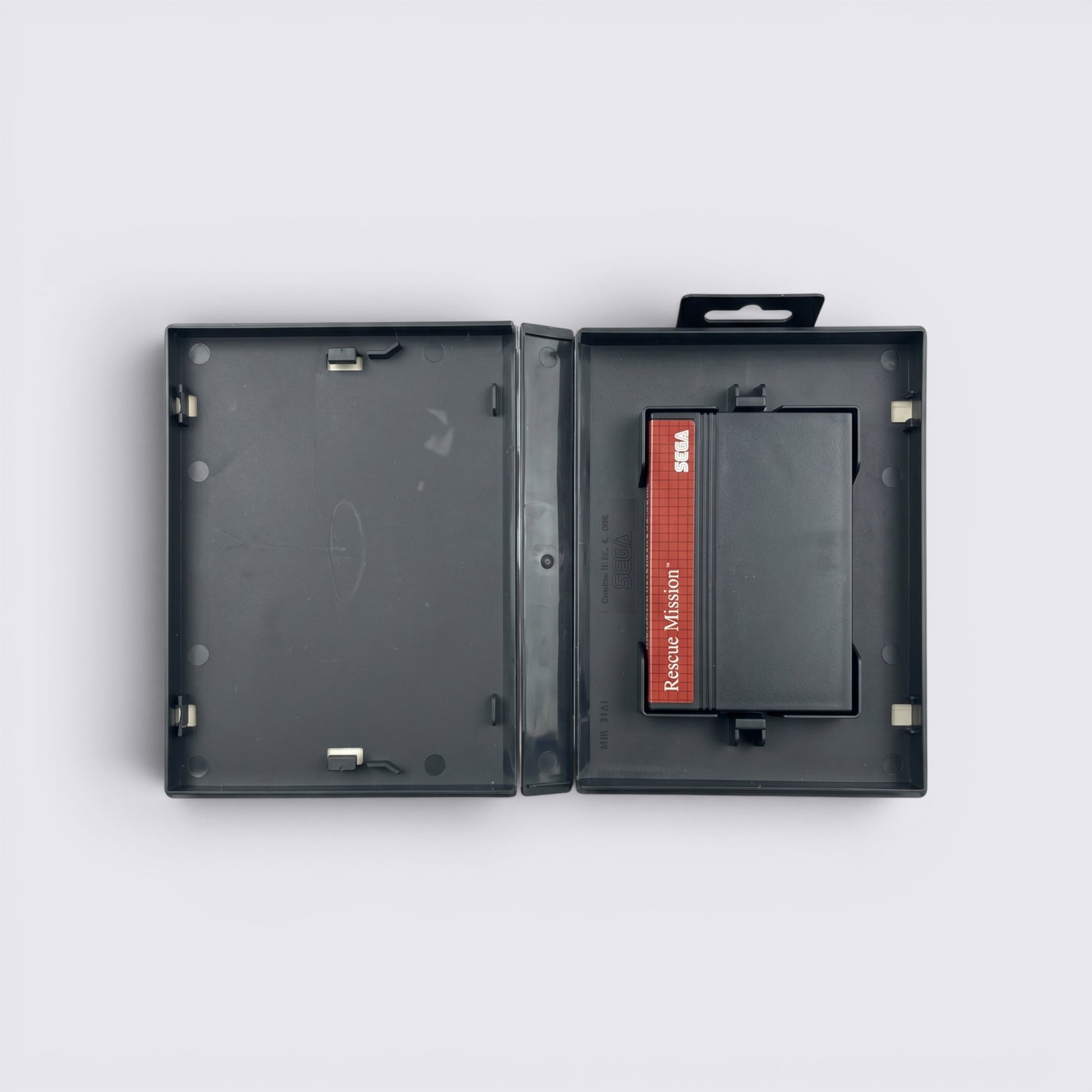 MrPixel Rescue Mission Sega Master System game cartridge inside its original black plastic storage case