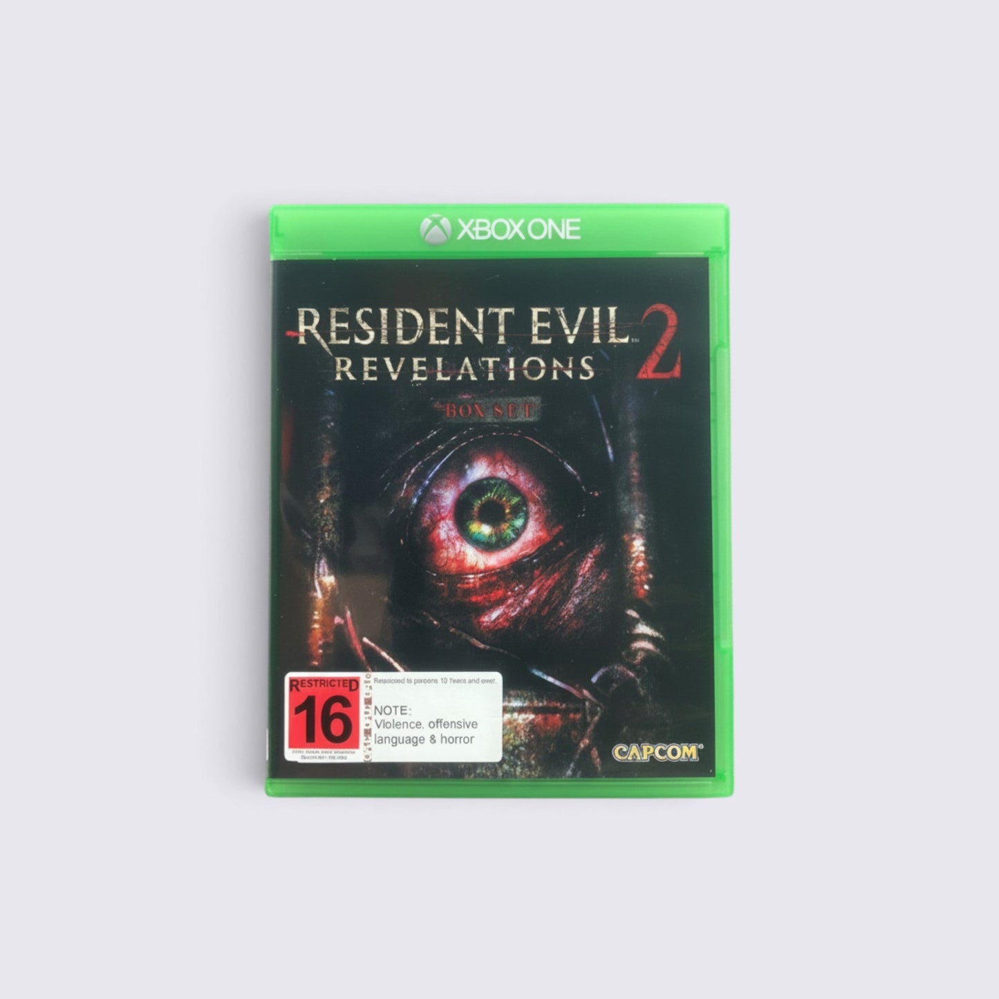 MrPixel Resident Evil Revelations 2 Xbox One game case featuring a close-up of a menacing eye on the cover art.