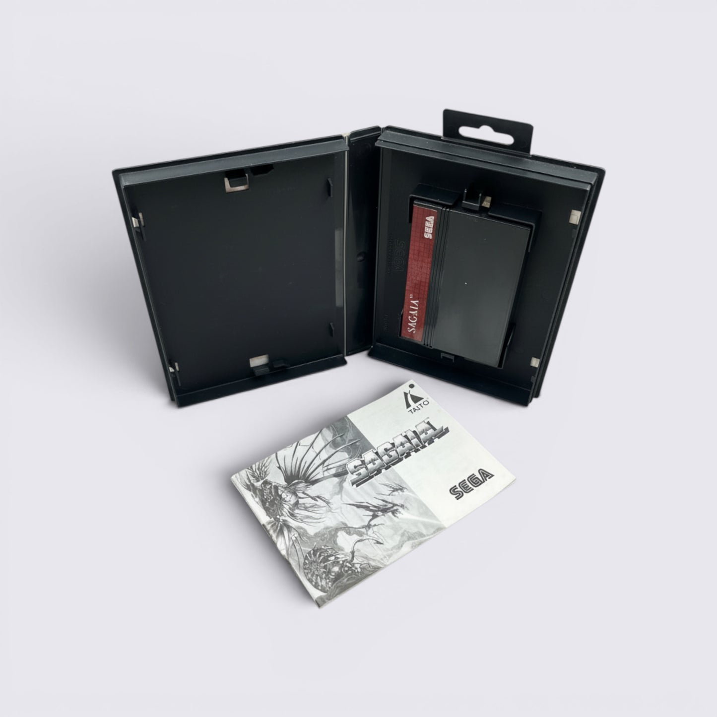 MrPixel Sagaia video game cartridge and instruction manual in a black plastic case for retro gaming collectors.