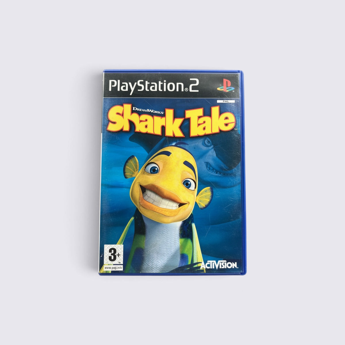 MrPixel Shark Tale PlayStation 2 game case featuring Oscar the fish on a blue underwater background