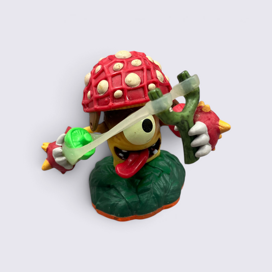 MrPixel Shroomboom Skylander figure with a red mushroom cap, yellow body, and green slingshot on a white background