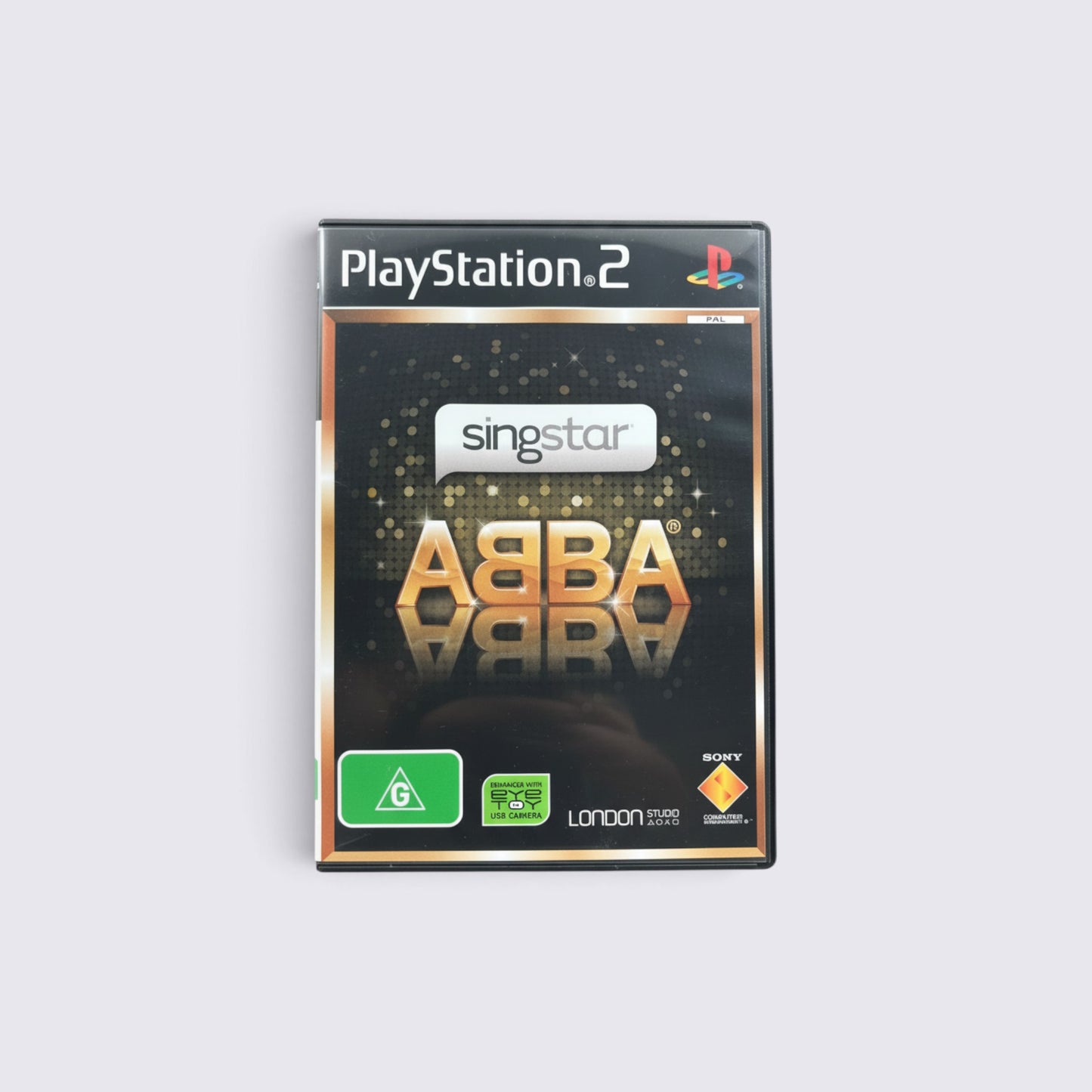 MrPixel SingStar ABBA PlayStation 2 game case featuring gold metallic lettering and a black glitter background.