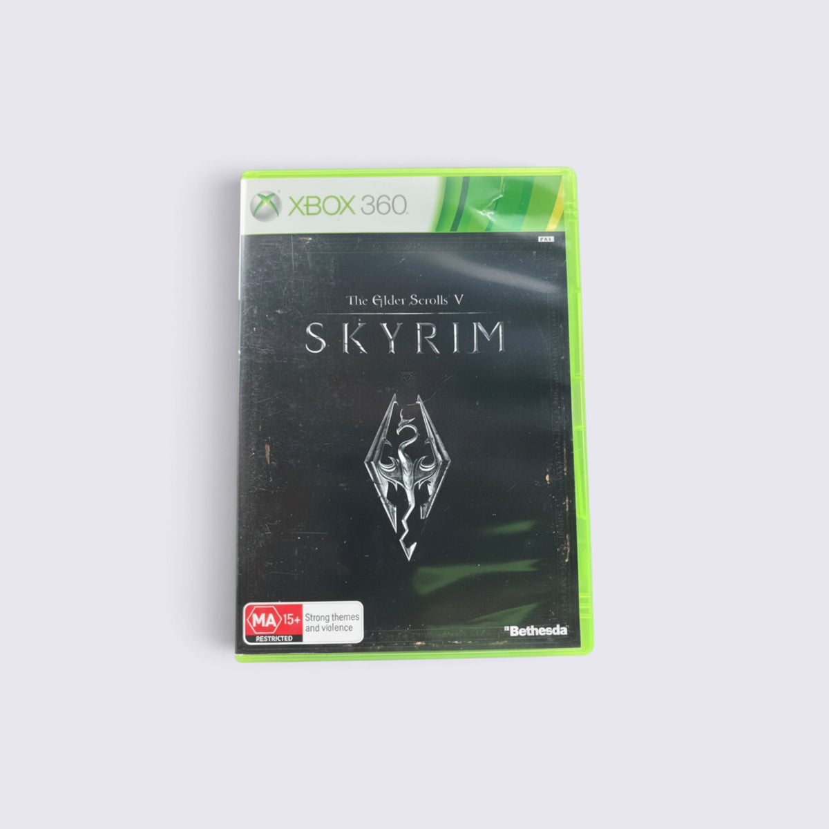 MrPixel The Elder Scrolls V: Skyrim game case for Xbox 360 featuring the iconic dragon logo on a black background